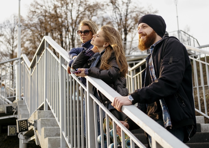 group-friends-admiring-view-stairs-together